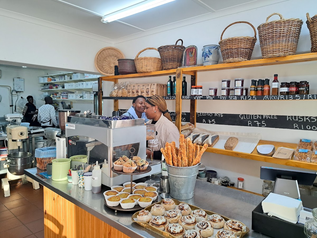 BROOD bakery counter displaying fresh cinnamon rolls, muffins, and breadsticks