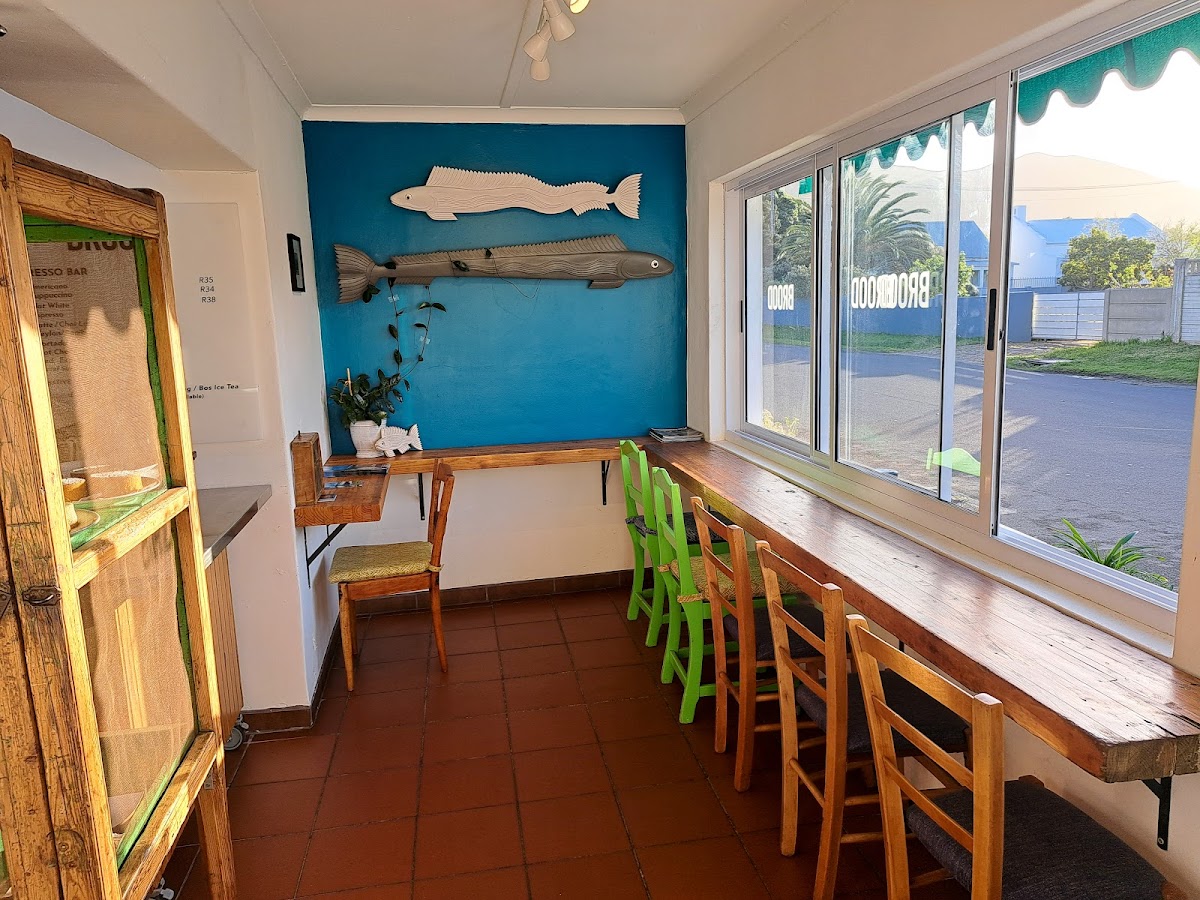 Window seating at BROOD with coastal fish wall art